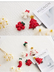Detailed view of handmade wool felt Christmas tree, snowflake and stocking ornaments