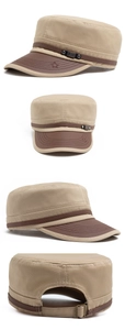 Detail of khaki cotton military cap featuring a leather brim and metal buckle