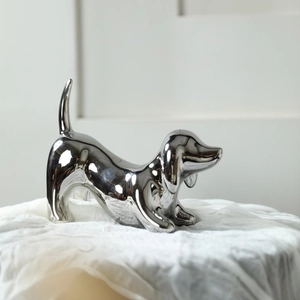 Modern minimalist silver dachshund dog statue ceramic decor with reflective mirror finish