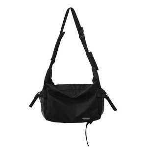 Large black nylon crossbody messenger bag with adjustable strap and side mesh pocket
