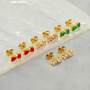 Detailed view of bow stud earring sets in various gemstone colors with gold finish