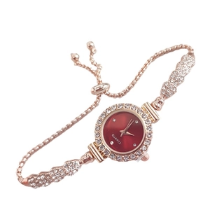 Elegant rose gold women's quartz watch with red dial and adjustable crystal strap