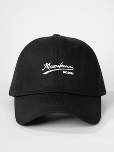 Detailed close-up of Mizoo bean white embroidery on black cotton baseball cap