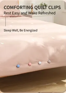 Detail of flower-shaped duvet clips in multiple colors with needle-free safety design