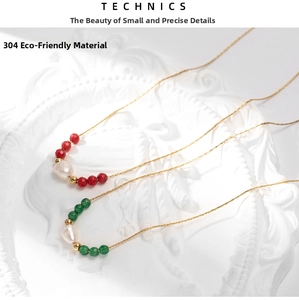 Detail of 304 stainless steel necklace featuring red beads and baroque pearl accents