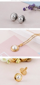 Detail of 18k gold and silver plated round pearl earrings and necklace set on soft background