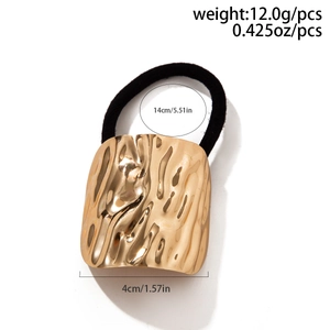 Detail view of golden hammered metal plate ponytail hair tie with size and weight metrics