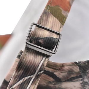 Macro detail of leaf camouflage canvas strap with adjustable matte black metal buckle