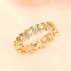 Elegant gold heart ring with sparkling zircons and openwork design for women