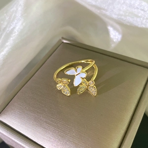 Elegant gold butterfly open ring with white enamel and cubic zirconia details