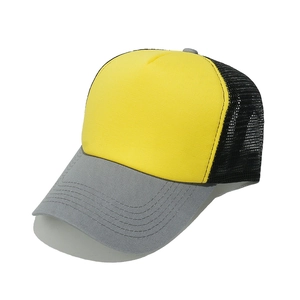 Close-up detail of a yellow and gray mesh trucker hat with a curved brim