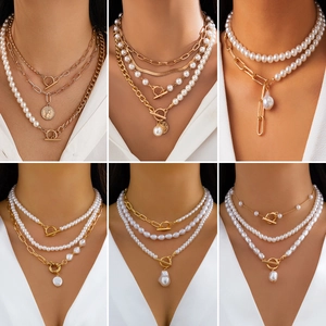 Baroque pearl necklaces with gold layered chains and T-bar clasps in six styles