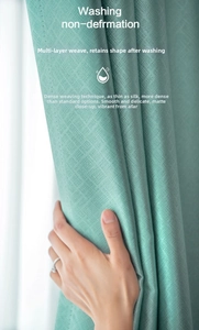 Close-up of green high-precision woven curtain fabric texture with a soft matte finish