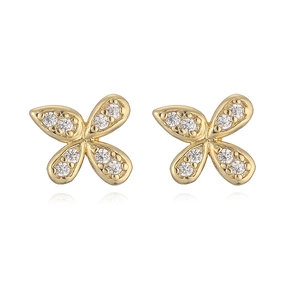 Macro detail of gold butterfly earrings with micro-paved white zircons on white backdrop