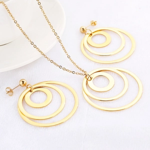 Minimalist gold titanium steel necklace and interlocking rings earrings set on white back