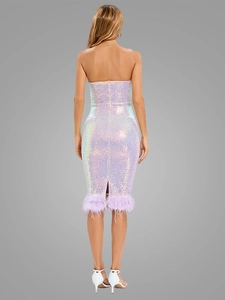 Detailed back view of sequined evening dress with delicate lilac ostrich feather hemline