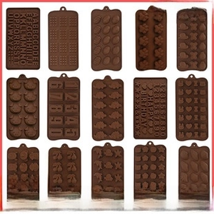 Macro detail of various brown silicone molds for chocolate and baking decorations