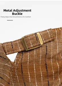 Macro detail of brown striped fabric and adjustable bronze metal buckle on newsboy cap