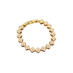 Bracelet plaqué or avec maillons floraux sertis de zircons et fermoir à rabat chic