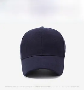 Detailed view of navy blue baseball cap fabric texture with a small metal logo detail