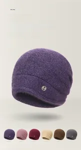 Detailed close-up of double-layered knit beanie hats in multiple assorted colors