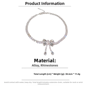 Detailed infographic of rhinestone bow necklace with 38.6cm length and 11.4g weight specs