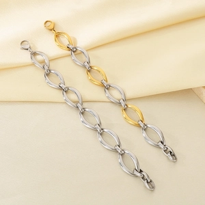 Polished hollow oval link bracelets in silver and gold tones on silk texture