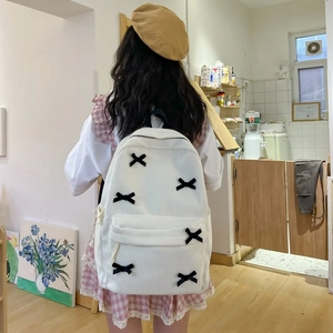 White corduroy backpack with black bows in Japanese preppy style for college students