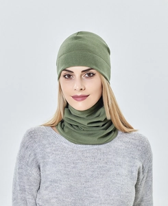 Close-up of olive green knitted beanie and neck gaiter set for winter warmth