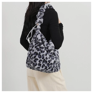 Detail of leopard print faux fur shoulder bag featuring soft ruched strap design