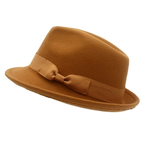 Detail view of the brown wool fedora hat with a matching grosgrain ribbon and bow accent