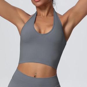 Close-up of grey seamless ribbed halter neck sports bra with deep V-neckline texture