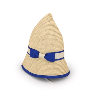 Detail of a pointed straw hat featuring a navy blue grosgrain ribbon and bow accent