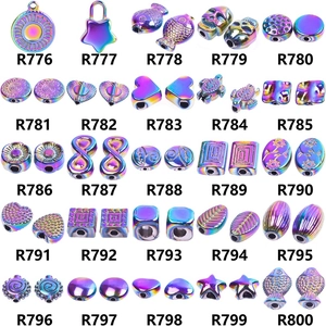 Detailed grid of crystal teardrop and angel wing alloy pendants in various shapes