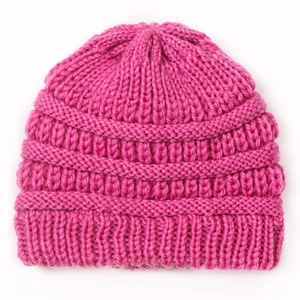 Detailed view of dark pink chunky knit texture and ribbed cuff on winter baby beanie