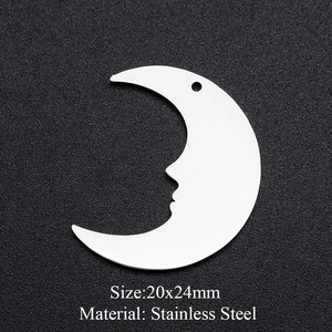 Macro shot of silver crescent moon face charm pendant made of stainless steel 20x24mm