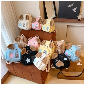 Detailed arrangement of colorful cute puppy backpacks in blue, pink, and yellow tones