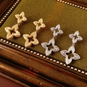 Retro gold and silver plated hollow four-leaf flower earrings with micro-inlaid stones