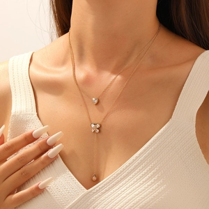 Double-layered gold stainless steel necklace with heart, butterfly and waterdrop pendants