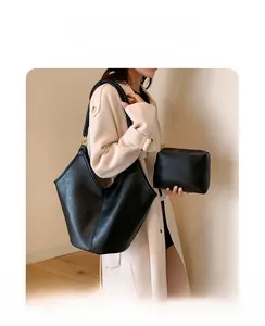 Classic black leather hobo shoulder bag set with matching small zipper pouch detail