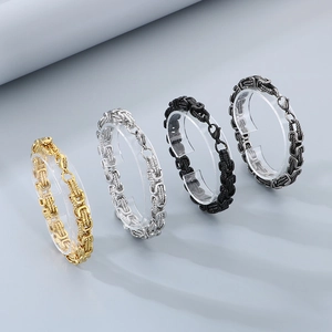 Byzantine twist stainless steel bracelets in gold, silver, black, and gunmetal finishes