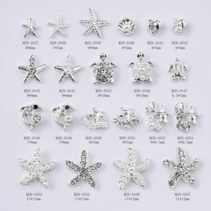 Silver marine theme nail charms set with starfish, shell and pearl in matrix layout
