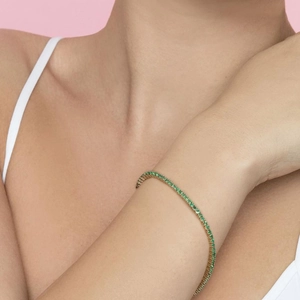 Elegant gold plated S925 silver tennis bracelet featuring radiant green zircon stones