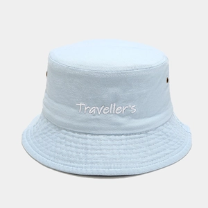 Detail of Traveller's embroidery on light blue washed cotton bucket hat with eyelets