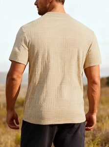 Detail shot of men's beige slim fit t-shirt featuring unique breathable textured fabric