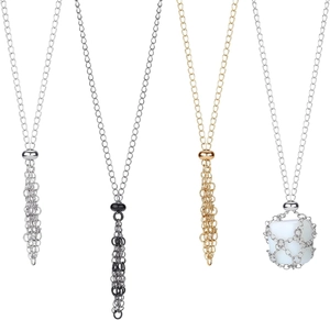 Detailed view of metal mesh necklaces with fringes in silver, gold, and gunmetal finishes