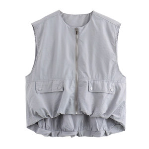 Close-up of light grey sleeveless vest with pleated elastic hem and utility pockets