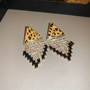 Detail of vintage leopard print earrings with sparkling tassel fringe and black beads