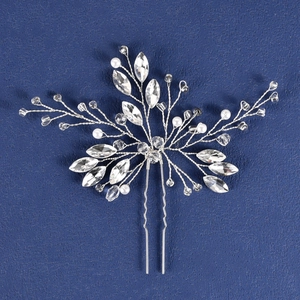 Handmade bridal hair pin with pearls and marquise crystals on a dark background