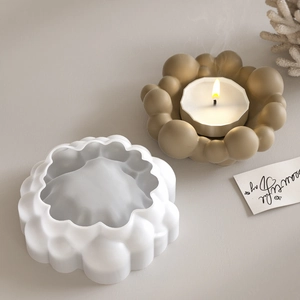 Detail of cloud bubble candle holder resin mold with a gold finished plaster tray display